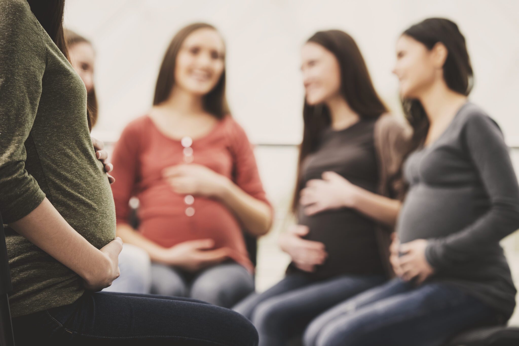 Close up.Pregnant girl holds onto stomach. Pregnant girls
